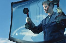 Professional auto glass technician installing windshield in Brookfield